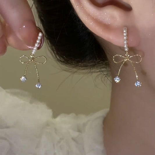 Boucles d'Oreilles Noeud Papillon Perlé - Élégance Féminine - Aurore Studio